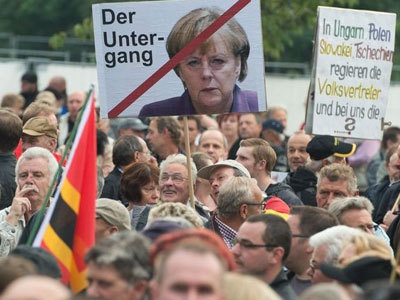 Меркель, протесты